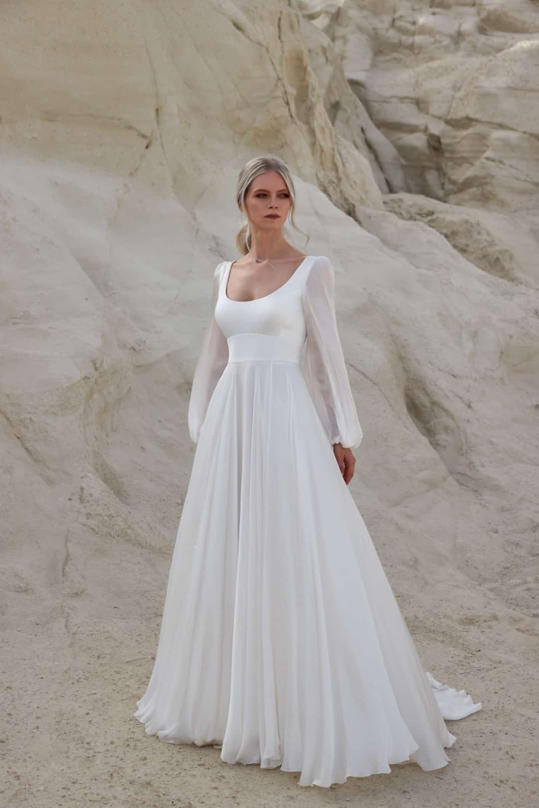 A perfect choice for minimalist brides, Sassi Holford Rhianna fits like a glove through the body, moving into soft flowing silk chiffon sleeves and a skirt that catch the light beautifully. Shop for your wedding dress at Your Dream Bridal Boston.