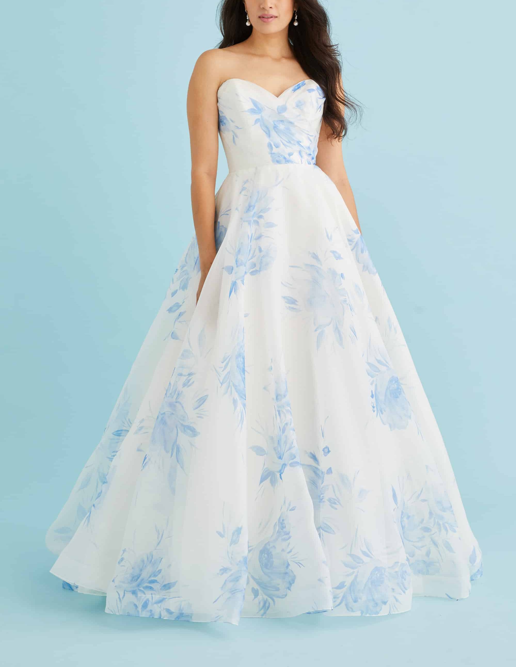 A soft organza Lea-Ann Belter Blythe ballgown. Organic ruching at the sweetheart bodice blooms into a full circle skirt with chapel train. Button-and-loop closure. Find your dream wedding dress at Your Dream Bridal near Boston.